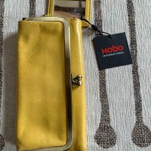 HOBO clutch. New with tags but does have some very minor stains as shown.